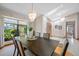 Bright dining room features a skylight and decorative chandelier above a large dining table at 5816 Dory Way, Tampa, FL 33615