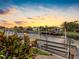Scenic waterway with wooden dock at sunset providing an area for boat lift at 5816 Dory Way, Tampa, FL 33615