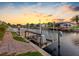 Waterfront property with a dock featuring a boat lift, offering convenient access to the canal at 5816 Dory Way, Tampa, FL 33615