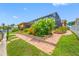 The walkway is lined with vibrant flowers and lush plants at 5816 Dory Way, Tampa, FL 33615
