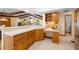 Well-appointed kitchen with a peninsula, built-in desk, and ample cabinet space at 5816 Dory Way, Tampa, FL 33615