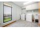 Bright laundry room with a window, offering a practical space for laundry tasks at 5816 Dory Way, Tampa, FL 33615