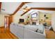 Bright living room featuring a stone fireplace, built-in shelves, and wood beam ceilings at 5816 Dory Way, Tampa, FL 33615