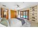 Spacious primary bedroom with large windows and an inviting view of the pool area at 5816 Dory Way, Tampa, FL 33615