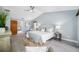 Lovely bedroom with decorative ceiling fan, a cozy chair, and an ensuite bath at 5816 Dory Way, Tampa, FL 33615