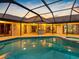 Large screened-in pool and hot tub, perfect for entertaining with beautiful backyard views at 5816 Dory Way, Tampa, FL 33615