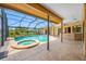 Gorgeous outdoor living with large, screened-in pool and bar area perfect for entertaining at 5816 Dory Way, Tampa, FL 33615