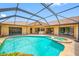 Gorgeous pool area with spa, covered seating area, and easy access from inside at 5816 Dory Way, Tampa, FL 33615