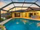 Enclosed back patio featuring an outdoor pool and outdoor bar for convenient entertaining at 5816 Dory Way, Tampa, FL 33615