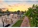 Waterfront view featuring a private dock with seating and lush landscaping along the canal at 5816 Dory Way, Tampa, FL 33615