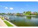 Picturesque waterfront view featuring serene canal, lush landscaping, private docks, and beautiful waterfront homes in a desirable community at 5816 Dory Way, Tampa, FL 33615