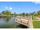 Picturesque waterfront view featuring a serene canal, lush landscaping, and private docks, perfect for boating enthusiasts at 5816 Dory Way, Tampa, FL 33615