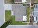 Aerial shot of the property, highlighting the roof, fenced yard, and surrounding neighborhood at 5821 Thrush Dr, New Port Richey, FL 34652