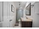 Bathroom with granite countertop vanity, modern fixtures, and a shower with a patterned curtain at 5821 Thrush Dr, New Port Richey, FL 34652