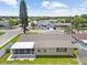 Charming single-story home featuring a screened porch and fenced yard, perfect for outdoor living at 5821 Thrush Dr, New Port Richey, FL 34652