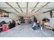 Spacious garage interior filled with storage and potential for organization and projects at 5821 Thrush Dr, New Port Richey, FL 34652