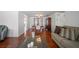 Open-concept living room with hardwood floors, furniture, and view to dining room at 5821 Thrush Dr, New Port Richey, FL 34652