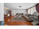 Comfortable living room with hardwood floors, furniture, and open floor plan at 5821 Thrush Dr, New Port Richey, FL 34652