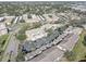 A captivating aerial view showcasing the condo community, featuring lush landscaping, a pool, and convenient parking at 6330 99Th N Way # 14F, St Petersburg, FL 33708