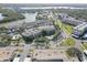 Aerial view of waterfront condos with mature trees and lush landscaping at 6330 99Th N Way # 14F, St Petersburg, FL 33708