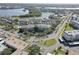 Gorgeous aerial view of waterfront condos with mature trees and lush landscaping at 6330 99Th N Way # 14F, St Petersburg, FL 33708