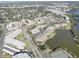 Scenic aerial view captures the condo community near a lake, highlighting well-maintained grounds and ample parking at 6330 99Th N Way # 14F, St Petersburg, FL 33708