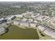 Scenic aerial view of lakeside community with mature trees and lush landscaping at 6330 99Th N Way # 14F, St Petersburg, FL 33708