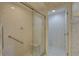 Accessible bathroom featuring a step-in shower with seating and grab bars for added convenience at 6330 99Th N Way # 14F, St Petersburg, FL 33708