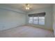 Spacious bedroom featuring a large window that floods the room with natural light and a ceiling fan for added comfort at 6330 99Th N Way # 14F, St Petersburg, FL 33708
