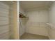 Walk-in closet with built-in shelving offering optimal storage and organization space at 6330 99Th N Way # 14F, St Petersburg, FL 33708
