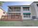 Exterior of the house showcasing a screened-in patio and a wooden deck at 6330 99Th N Way # 14F, St Petersburg, FL 33708