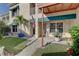 Charming condo entrance featuring a flag, and manicured landscaping at 6330 99Th N Way # 14F, St Petersburg, FL 33708