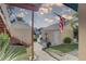 Inviting condo exterior, featuring a flag, stairway and lush landscaping at 6330 99Th N Way # 14F, St Petersburg, FL 33708