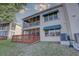 Exterior of the house showcasing a screened-in patio and a wooden deck at 6330 99Th N Way # 14F, St Petersburg, FL 33708