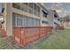 Exterior view of a condo, including a wooden deck perfect for outdoor relaxation and enjoying the surrounding landscape at 6330 99Th N Way # 14F, St Petersburg, FL 33708