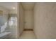 Inviting hallway view with neutral tile flooring and ample natural light at 6330 99Th N Way # 14F, St Petersburg, FL 33708