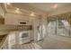 Bright kitchen featuring white appliances, ample cabinet space, and a charming window with natural light at 6330 99Th N Way # 14F, St Petersburg, FL 33708