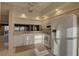 Bright kitchen featuring white appliances, ample cabinet space, and tile flooring at 6330 99Th N Way # 14F, St Petersburg, FL 33708