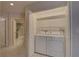 Convenient laundry closet with a washer and dryer, located near the bathroom at 6330 99Th N Way # 14F, St Petersburg, FL 33708