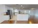 Bright kitchen with stainless steel appliances, granite countertops, and tile flooring at 708 Pearl Cir, Brandon, FL 33510