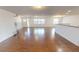Bright living room with wood floors and an open layout to the kitchen at 708 Pearl Cir, Brandon, FL 33510