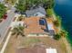 Waterfront home with solar panels, and a screened lanai, nestled along a serene canal at 709 47Th E St, Bradenton, FL 34208
