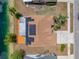 Aerial view of a home with solar panels on the roof and a wooden deck at 709 47Th E St, Bradenton, FL 34208