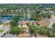 Aerial view of the home showcasing the lake and surrounding neighborhood at 709 47Th E St, Bradenton, FL 34208