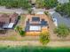 A waterfront property featuring a solar-paneled roof and a spacious deck at 709 47Th E St, Bradenton, FL 34208