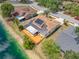 Waterfront home with deck, patio, and solar panels providing modern, energy-efficient living at 709 47Th E St, Bradenton, FL 34208