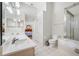 Bathroom featuring a dual sink vanity, a walk-in shower, and a tub at 709 47Th E St, Bradenton, FL 34208