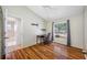 A sunlit bedroom with hardwood floors, complemented by a window and neutral wall colors at 709 47Th E St, Bradenton, FL 34208