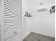 Walk-in closet with wood-look tile floors and wire shelving for storage at 709 47Th E St, Bradenton, FL 34208