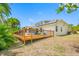Large backyard with wooden deck perfect for enjoying outdoor space and relaxing at 709 47Th E St, Bradenton, FL 34208